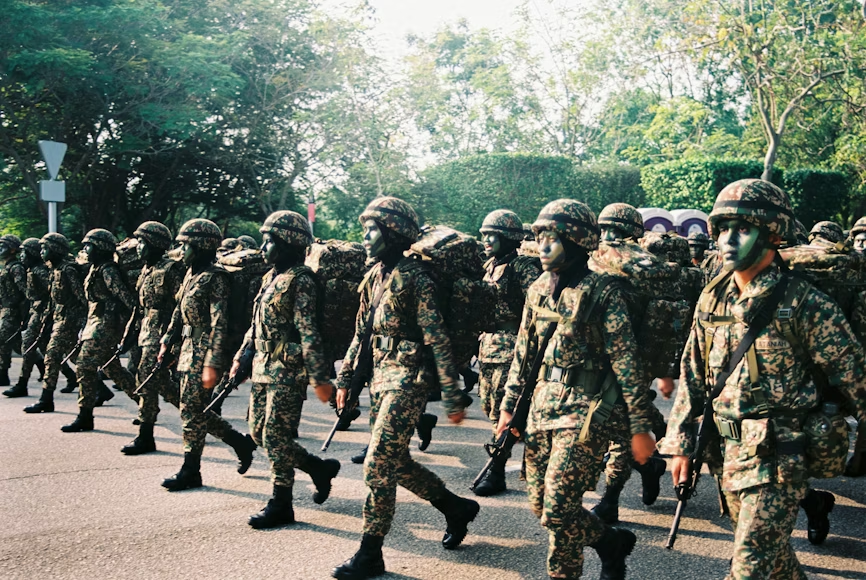 why military coups happen illustrated by armed soldiers marching in formation